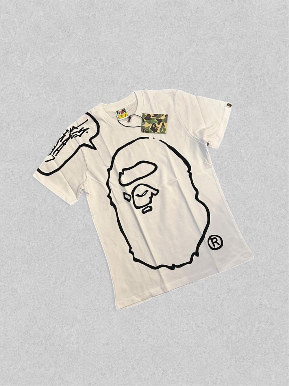 Bape White Tee with Black Ape Outline and Camo Pocket